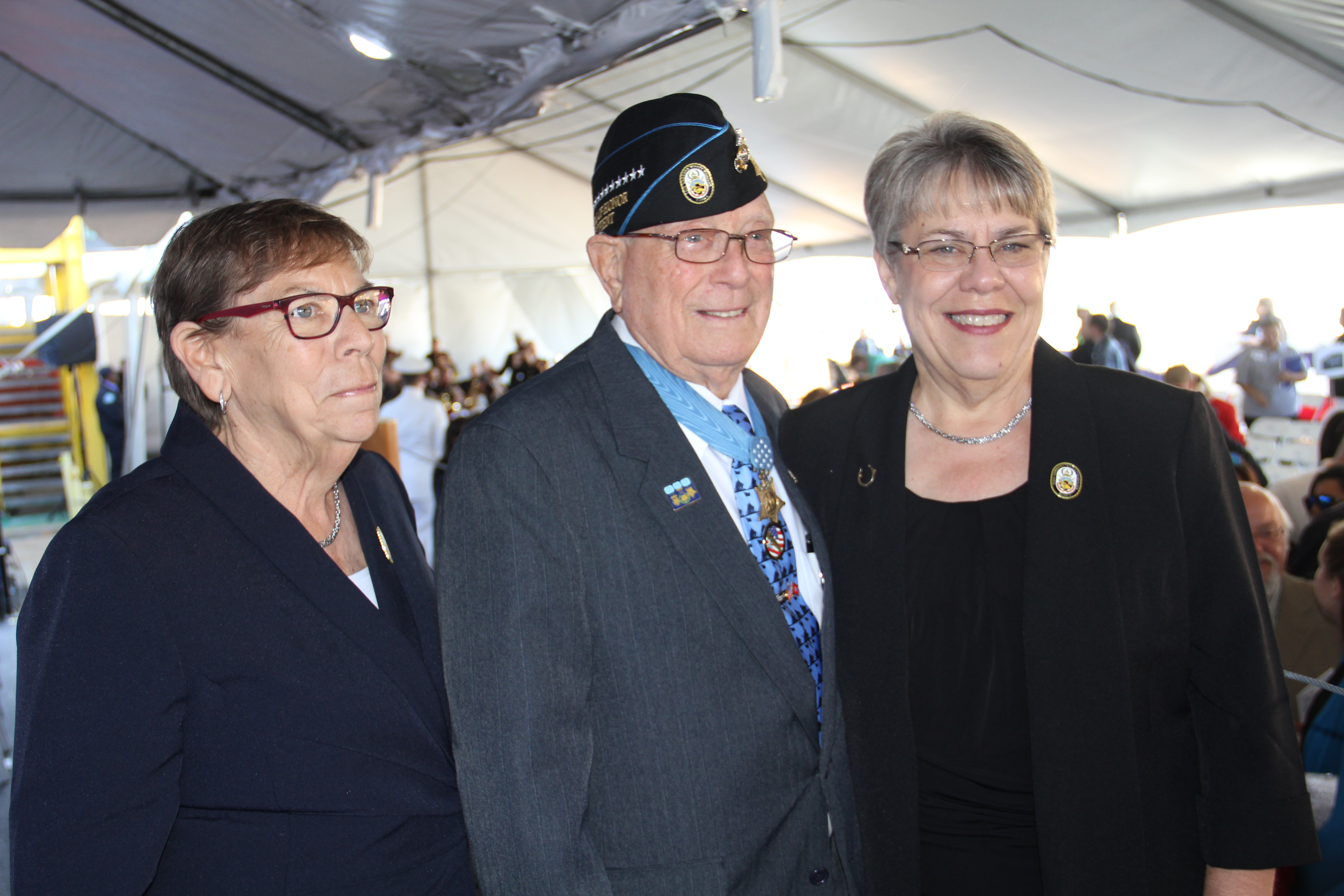 Hershel "Woody" Williams with daughters Travie Ross and Tracie Ross at the christening of the USNS Hershel "Woody" Williams expeditionary sea base built by General Dynamics NASSCO.