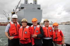 General Dynamics NASSCO President Kevin Graney, Hershel "Woody" Williams, and Williams' family view the expeditionary sea base bearing his name.